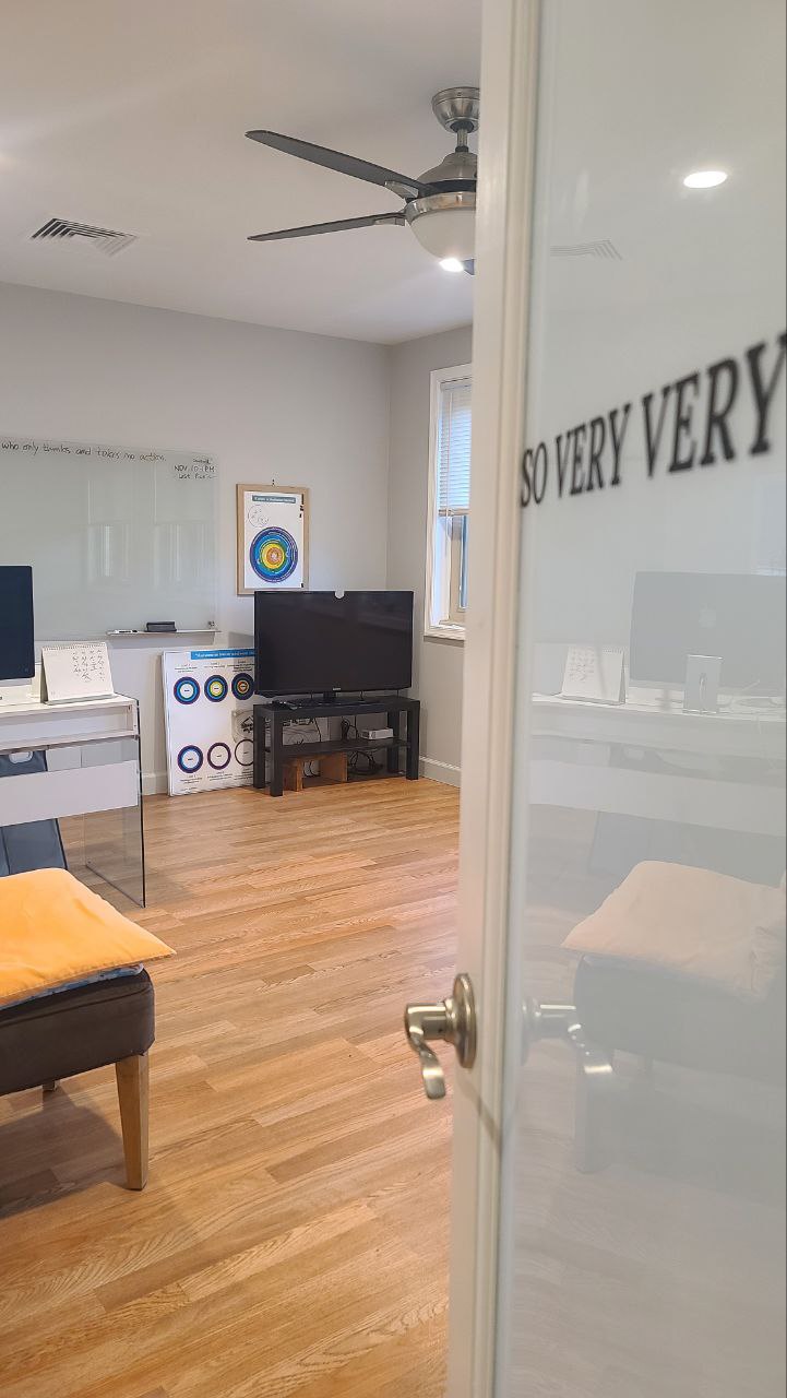 Interior lounge and study room at Arlington Meditation with seating and workspace