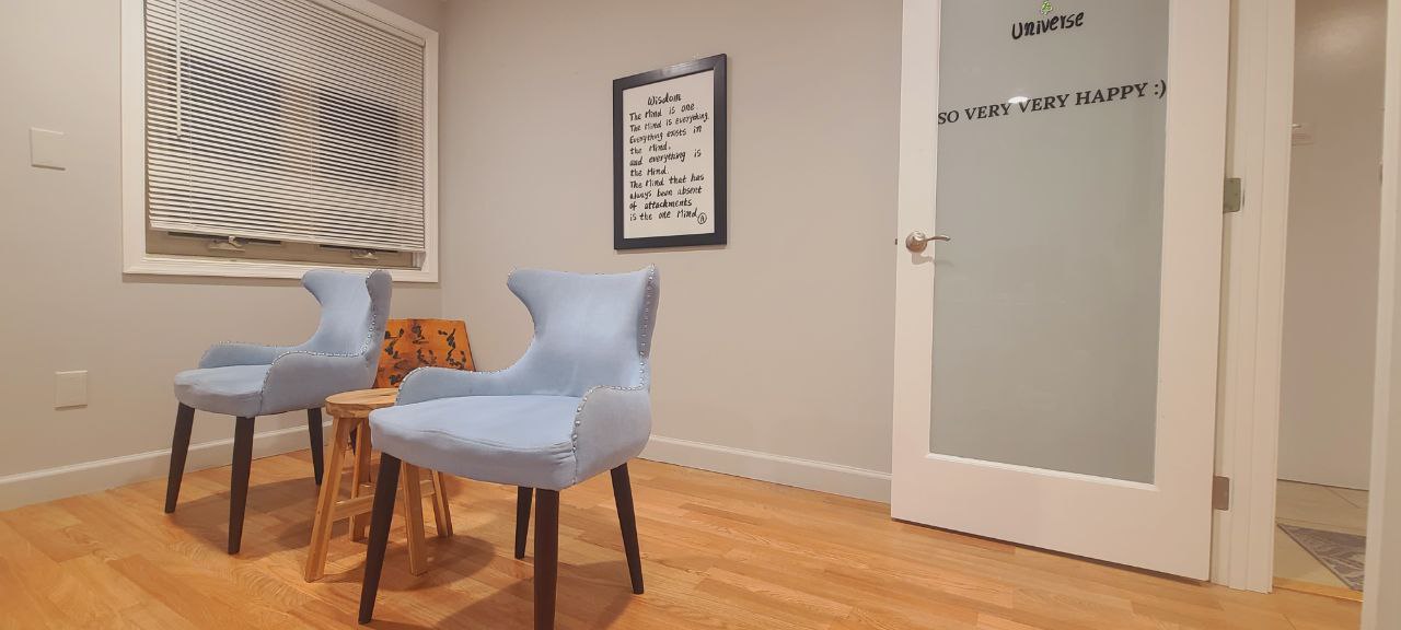 Cozy seating nook at Arlington Meditation with two chairs for one-on-one sessions